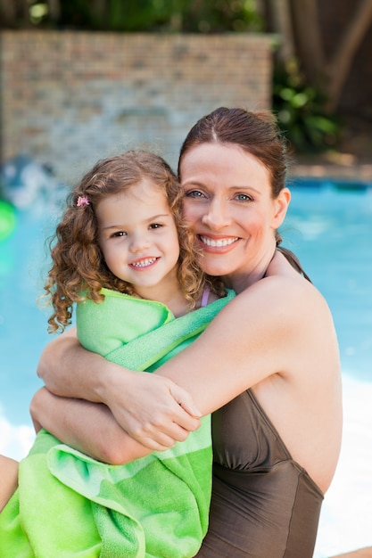 Mother hugging her daughter