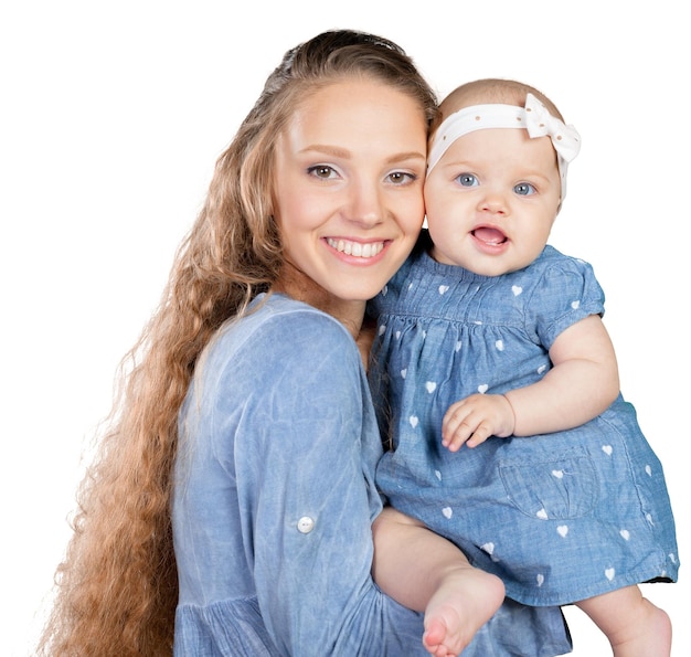 Mother hugs a young child