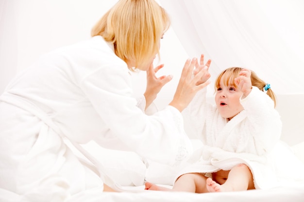 Mother playing with daughter