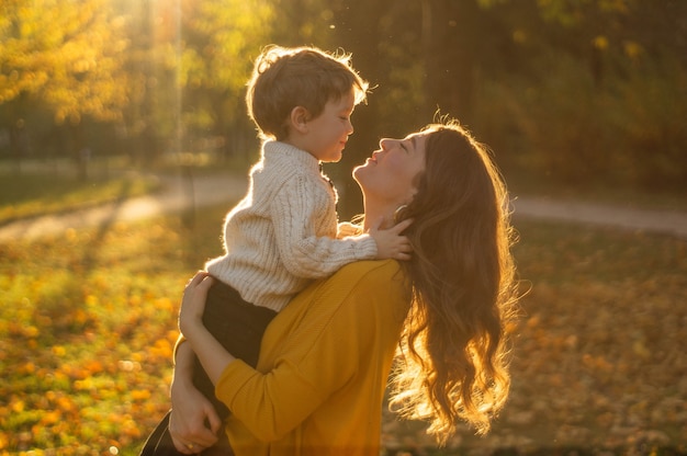 Mother and son in the autumn park