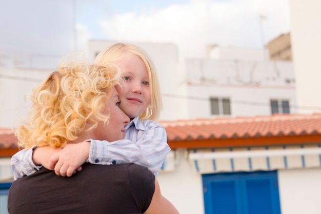 Mother and son children hug and love together with happiness 