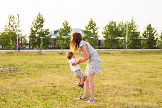 Mother and Son Having Fun in summer nature.