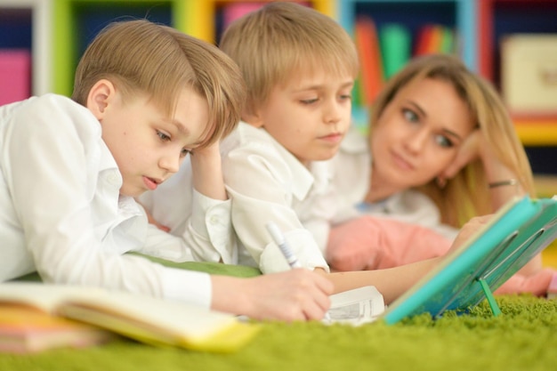 Mother and sons doing homework