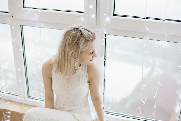 Mother  in white with Christmas lights