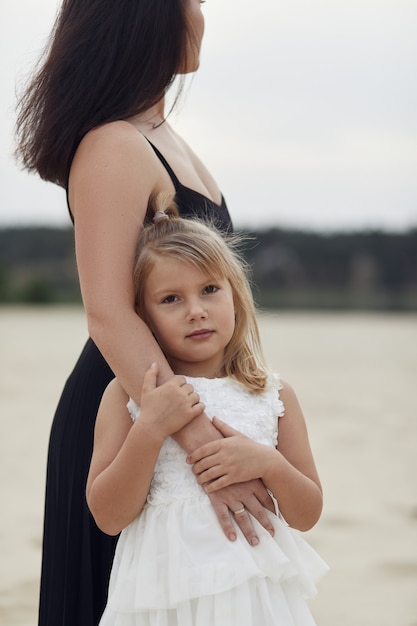 Mother with daughter walk on nature