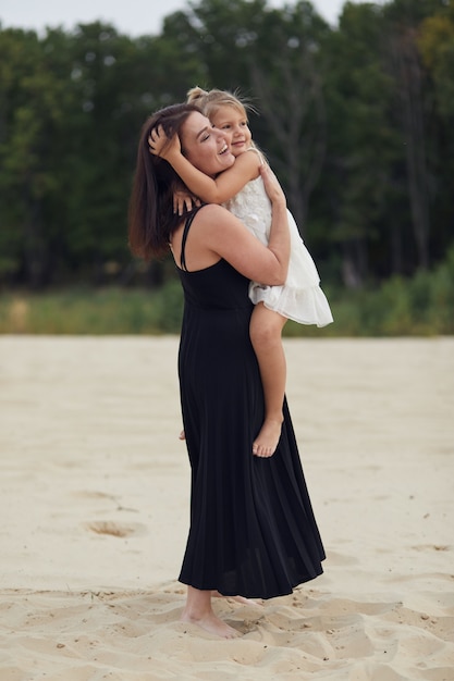 Mother with daughter walk on nature