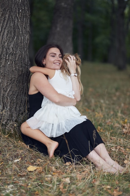 Mother with daughter walk on nature