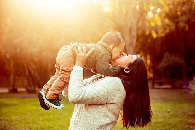 Mother with her baby son in a natural landscape