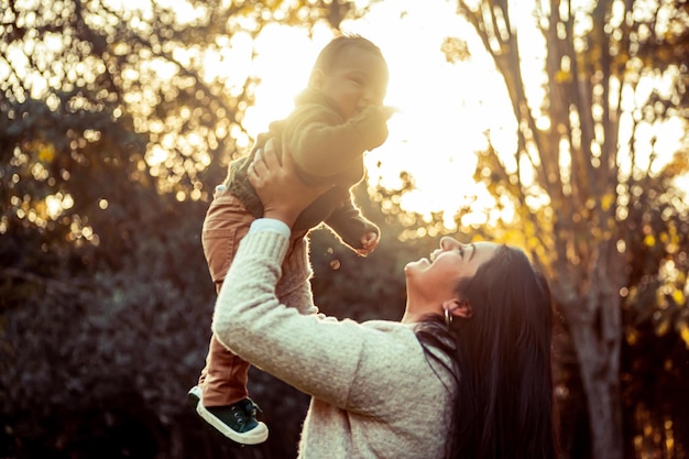 Mother with her baby son in a natural landscape