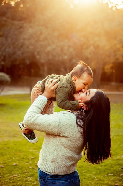 Mother with her baby son in a natural landscape