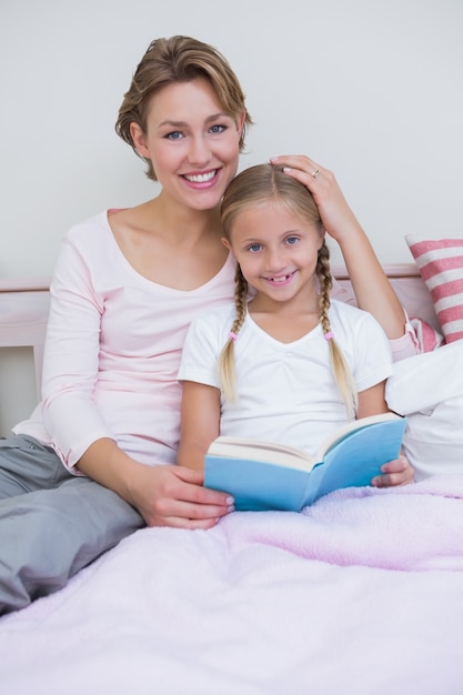 Mother with her daughter at bedtime