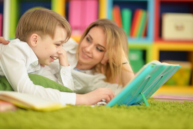 Mother with her son doing homework  at home