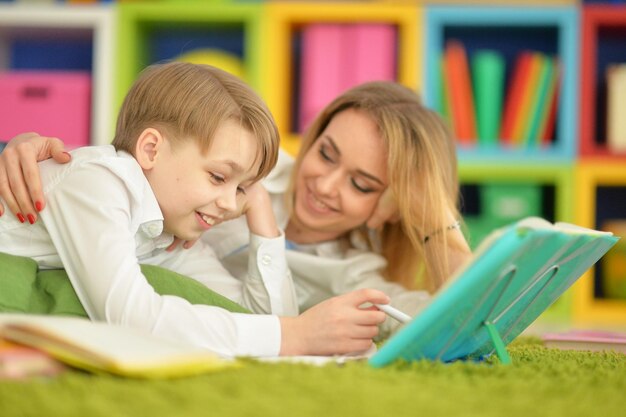 Mother with her son doing homework