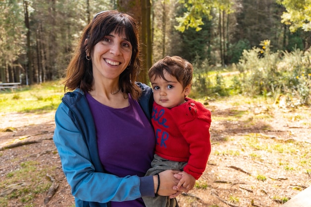 A mother with her son on top of Mount Andatza in the forest in the town of Usurbil Gipuzkoa Basque Country