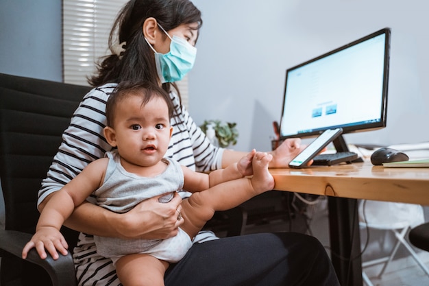 Mother with masks working from home