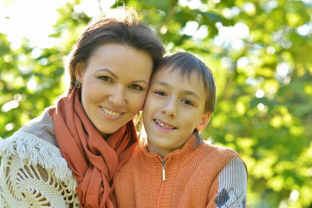 Mother with son in autumn park