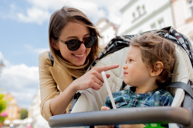 Mother with a toddler boy in old city center