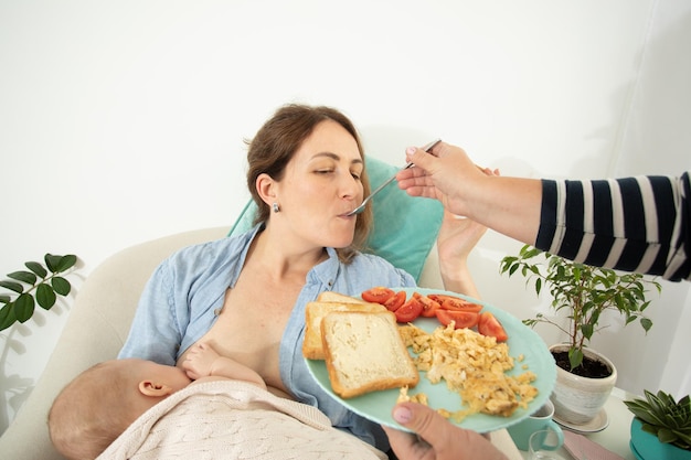 Motherhood support help for eating to young mother