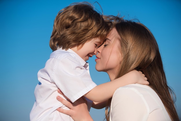 Mothers love closeup portrait of mother and child kissing mother hugging and embracing son mothers d