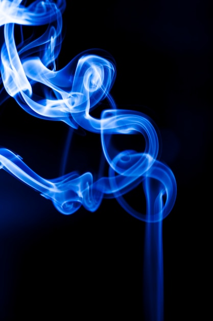 Motion blue smoke on black background.