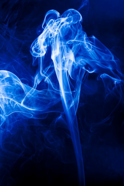 Motion blue smoke on black background.