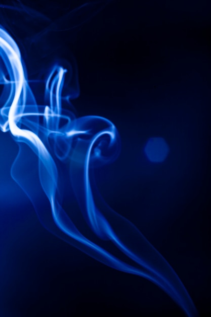 Motion blue smoke on black background.