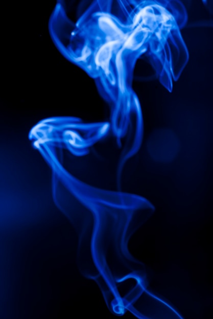 Motion blue smoke on black background.