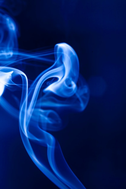 Motion blue smoke on black background.