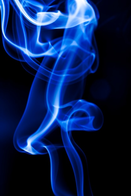 Motion blue smoke on black background.