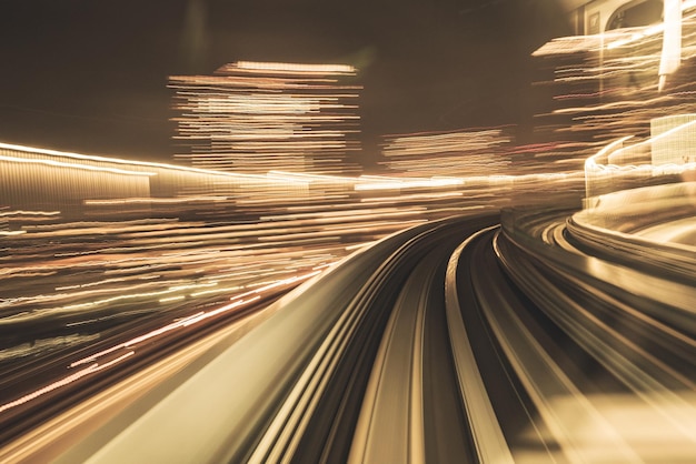 Motion blurred of train moving inside tunnel with daylight in tokyo Japan yellow color background concept