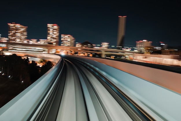 Motion blurred of train moving inside tunnel with daylight in tokyo Japan