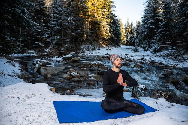 Motivation yoga on the wild nature near the river