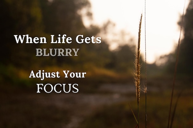 Motivational and inspirational quote When life gets blurry adjust your focus With blurred pathway background