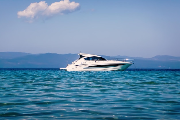 Motor boat floating on clear turquoise water