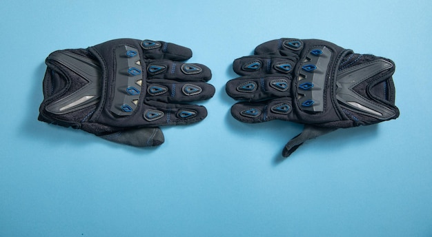 Motorcycle gloves on the blue background