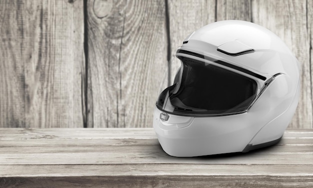 Motorcycle Helmet on wooden background, safety and protection