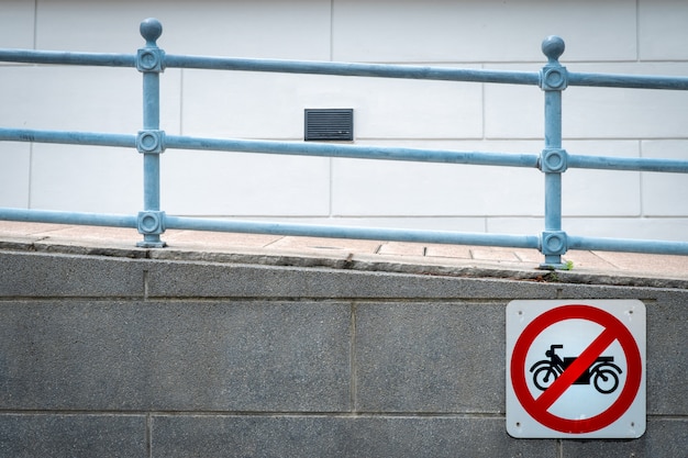 Motorcycle no entry sign install in front of tunnel under the road