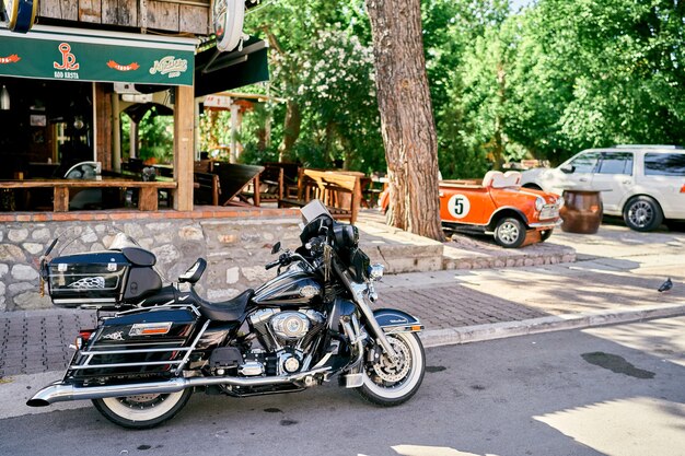 Motorcycle stand near the bar in the park