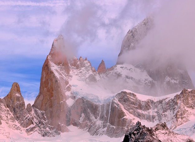 Mount Fitzroy at sunset. Pink clouds and blue sky. Los Glaciares National Park.  El Chalten. Andes.  Argentina. South America