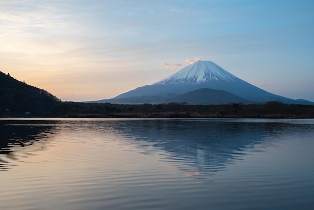 Mount Fuji landscape with reflection on lake surface in sunrise time. View at Lake Shoji Shojiko