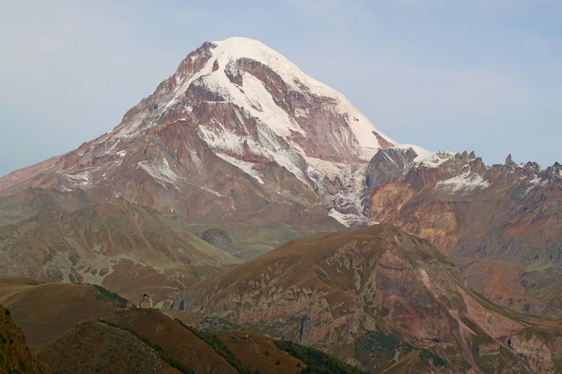 Mount Kazbek with Gergeti Trinity Church in Foreground as Seen from Stepantsminda Town, Georgia Country