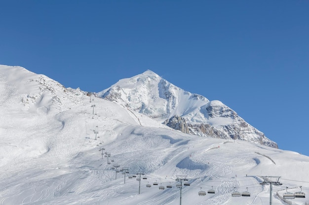 Mount Tetnuldi and the lift of the ski resort nearby the Caucasus Mountains freeride