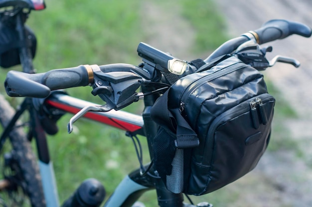 Mountain bike with a bag on the handlebars