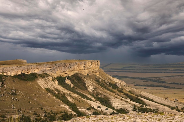 Mountain canyon in the dry season against a stormy sky White Rock Crimea