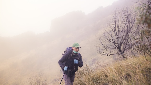 mountain climber on his way to the highest peak