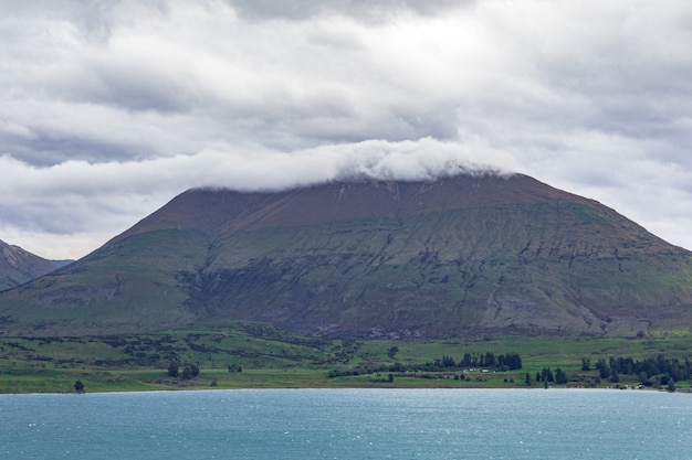 Mountain in a cloud cap Queenstown area Lake Wakatipu New Zealand