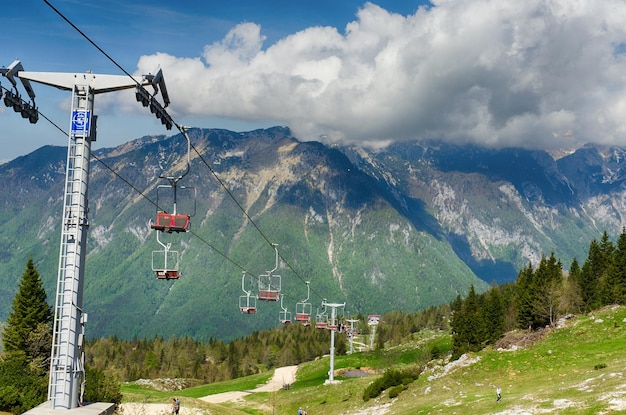 Mountain cottage, house on hill. Alpine meadow landscape. Cable car. Big Pasture Plateau. Slovenia