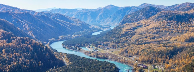 Over a mountain gorge with a river autumn view