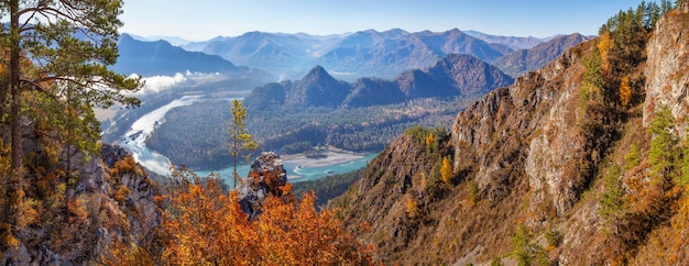 Over a mountain gorge with a river autumn view