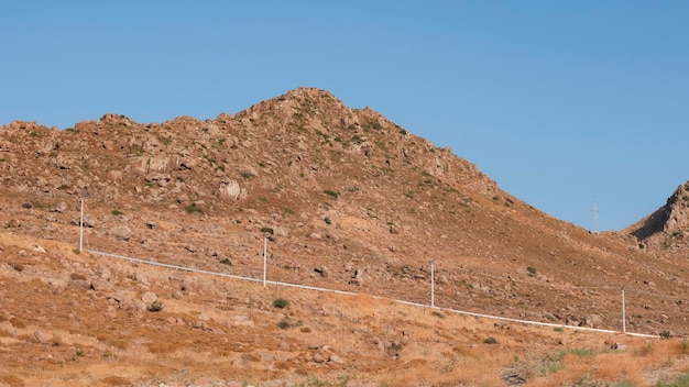 Mountain landscape and electricity poles